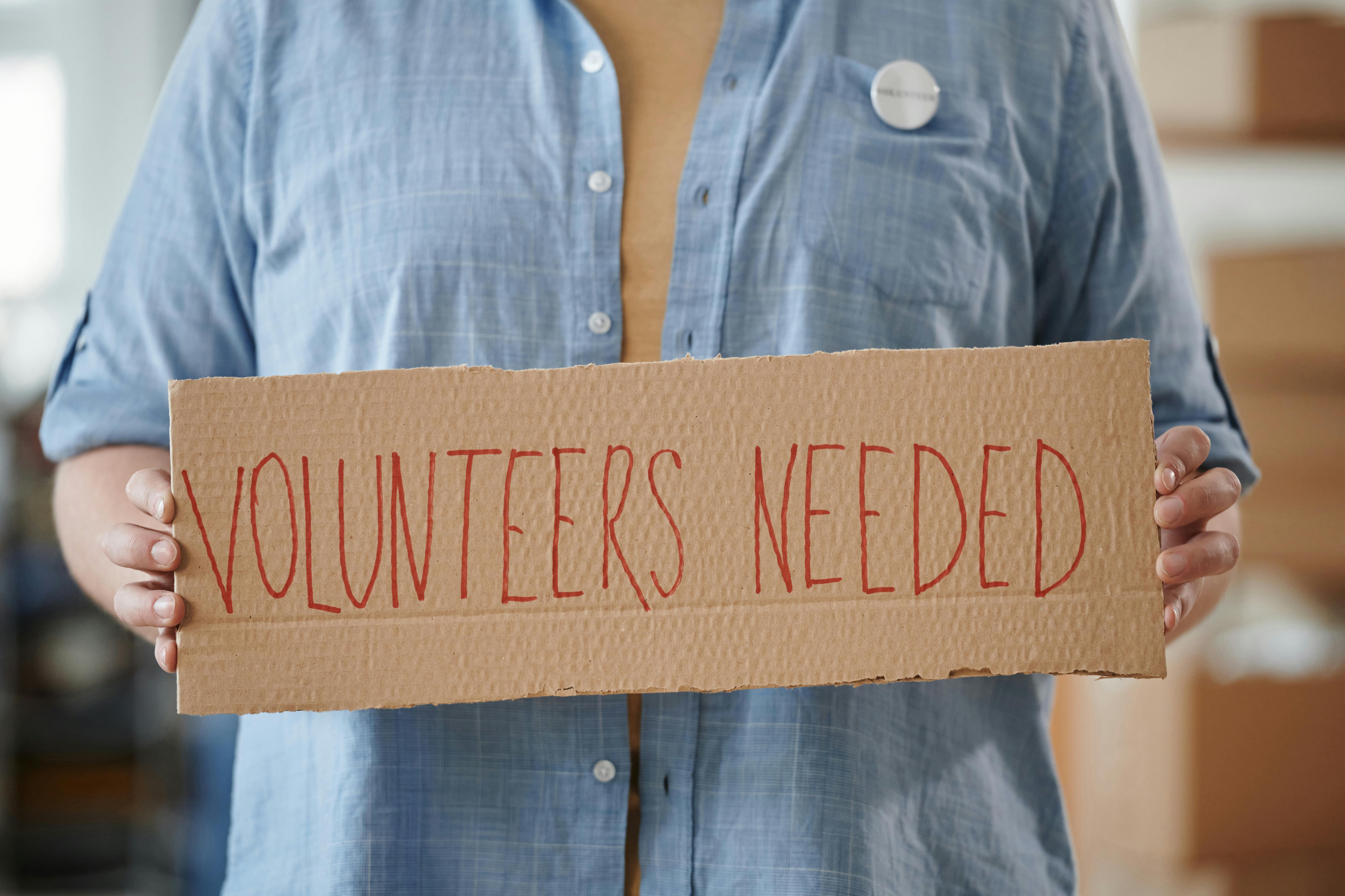 A group of smiling volunteers working together.